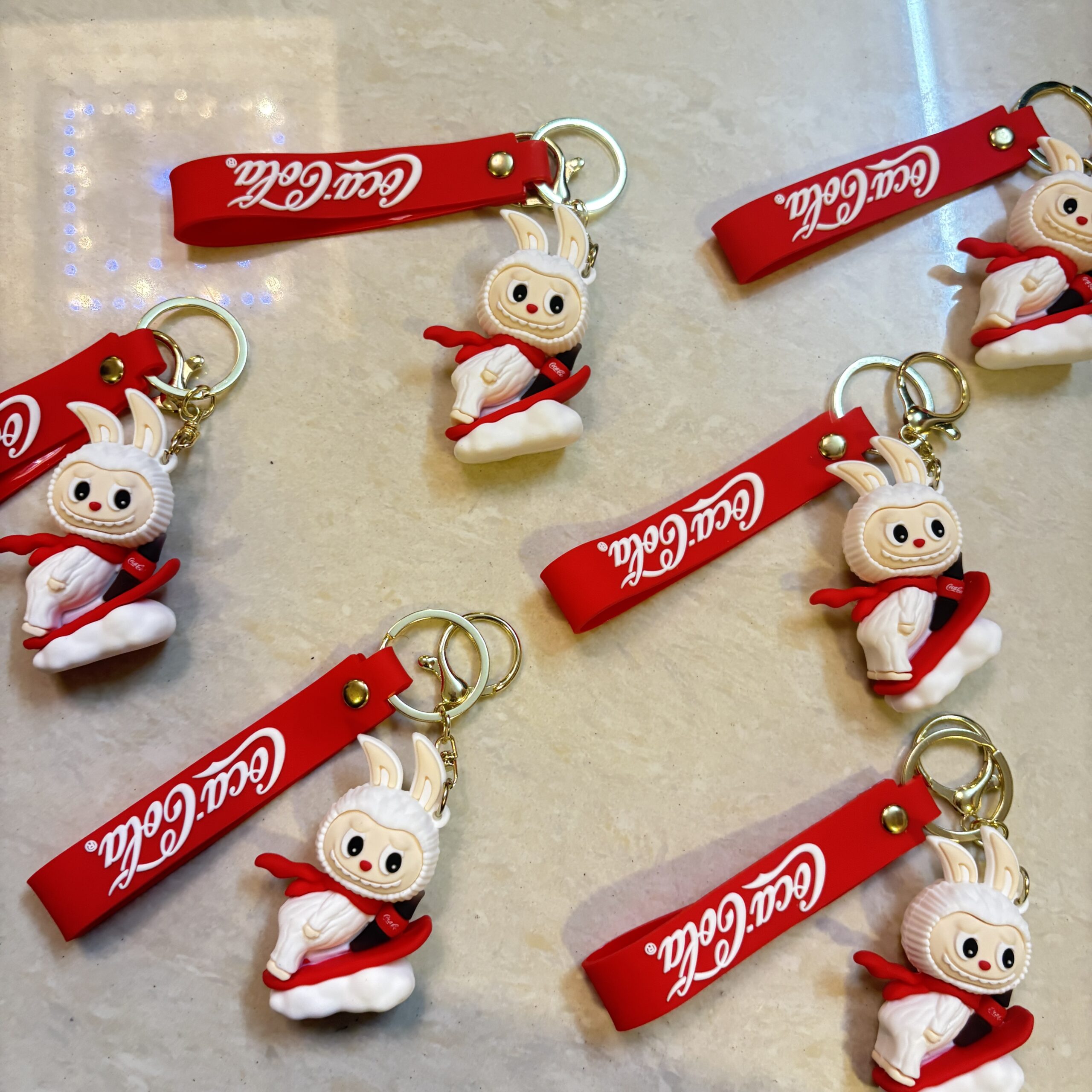 White Labubu with coke keychian